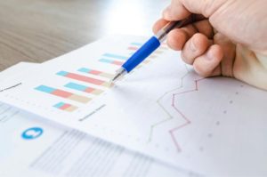 a person's hand examining data on a graph Source: Photo by Lukas: https://www.pexels.com/photo/close-up-photo-of-survey-spreadsheet-590022/