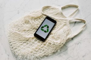a cell phone on a string bag 