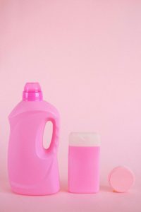 Photo by Anna Shvets: https://www.pexels.com/photo/plastic-containers-for-liquids-in-studio-5218018/A pink bottle of liquid and a pink sponge