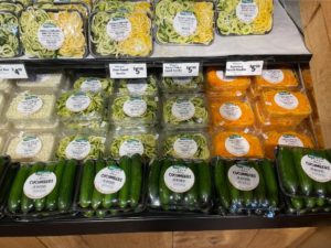 A display of vegetables on a shelf 