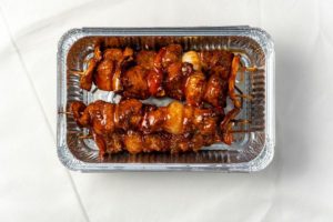 A tray of food on a white surface Photo by Shardar Tarikul Islam: https://www.pexels.com/photo/meat-in-box-8973185/