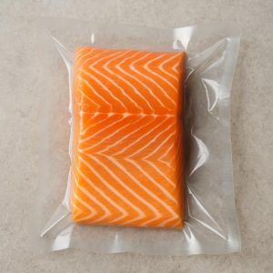 A piece of salmon in a plastic package