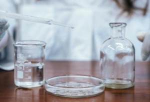 a scientist with beakers