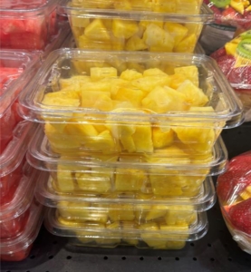 pieces of cut pineapple in plastic packaging