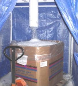 plastic flake being pumped into a box 