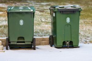 Recycling bins on a curb. Photo by Efrem Efre : https://www.pexels.com/photo/green-garbage-bins-in-snowy-jonkoping-yard-30749455/