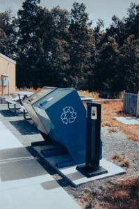 a recycling bin Photo by Erik Mclean: https://www.pexels.com/photo/trash-can-in-public-park-8827009/