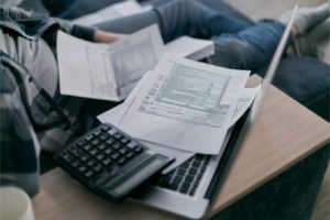 a laptop and some papers