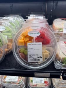 a four compartment package with snacks inside 