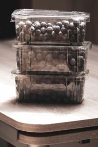 blueberries in plastic packaging Photo by Katherine Mihailova: https://www.pexels.com/photo/three-containers-of-blueberries-on-wooden-table-8145519/