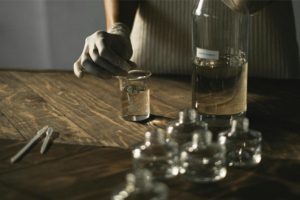 someone measuring something in a beaker