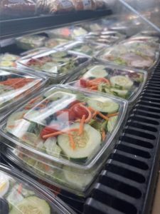 fresh salad in a clear, plastic package. 