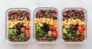 Three plastic packages containing food