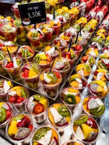 A group of plastic cups of fruit Photo by AXP Photography: https://www.pexels.com/photo/a-display-of-fruit-in-cups-with-prices-on-them-27397503/