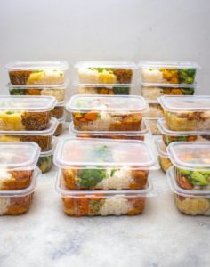 A group of plastic containers with food inside AI-generated content may be incorrect.