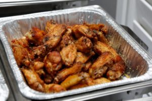 chicken wings in an aluminum container