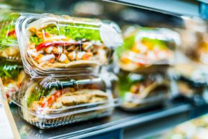 Sandwiches in clear plastic packaging.