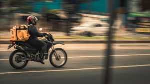 delivery driver: Photo by Francisco Ferreira: https://www.pexels.com/photo/man-riding-motorcycle-on-the-road-13311393/